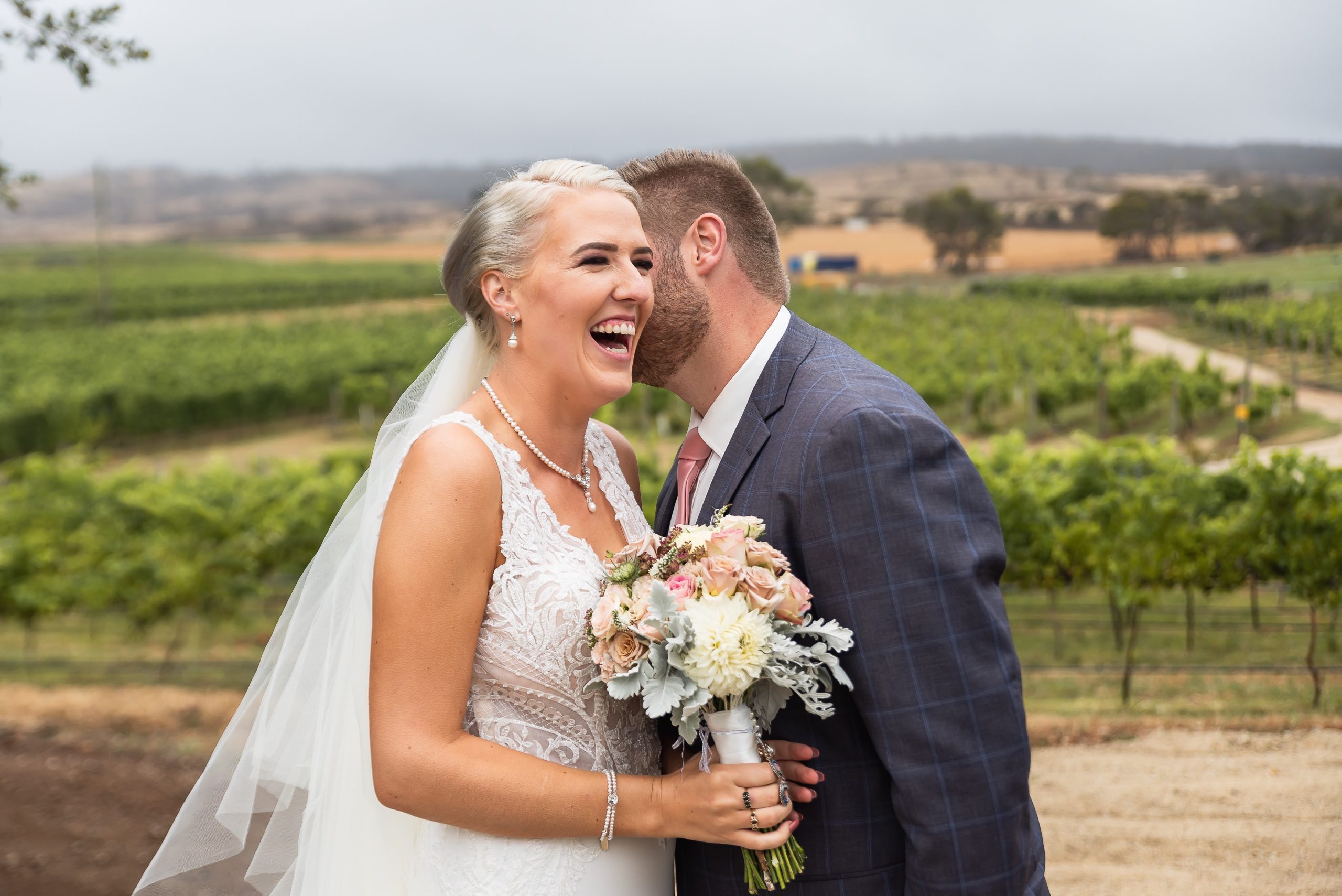 Bride and groom celebrating at Craigie Knowe Vineyard